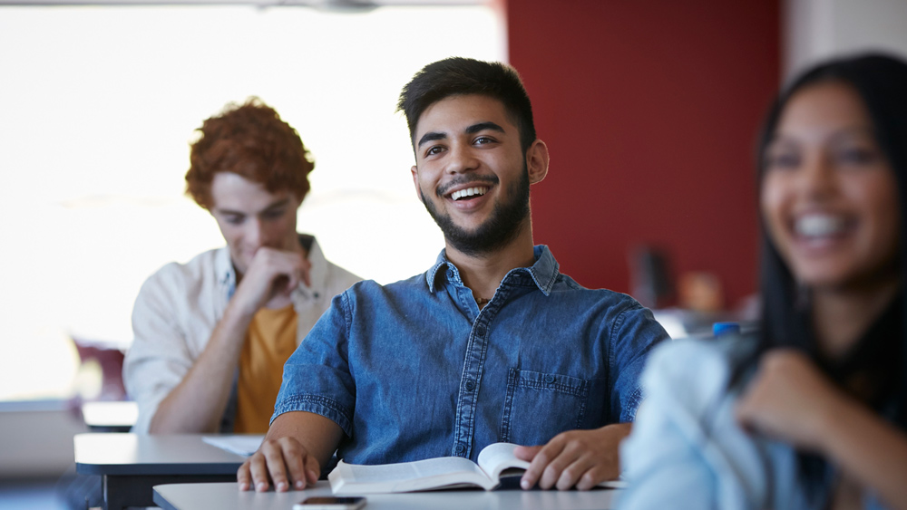teenage kids in classroom laughing