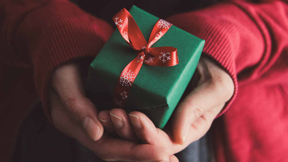 hands holding a small present