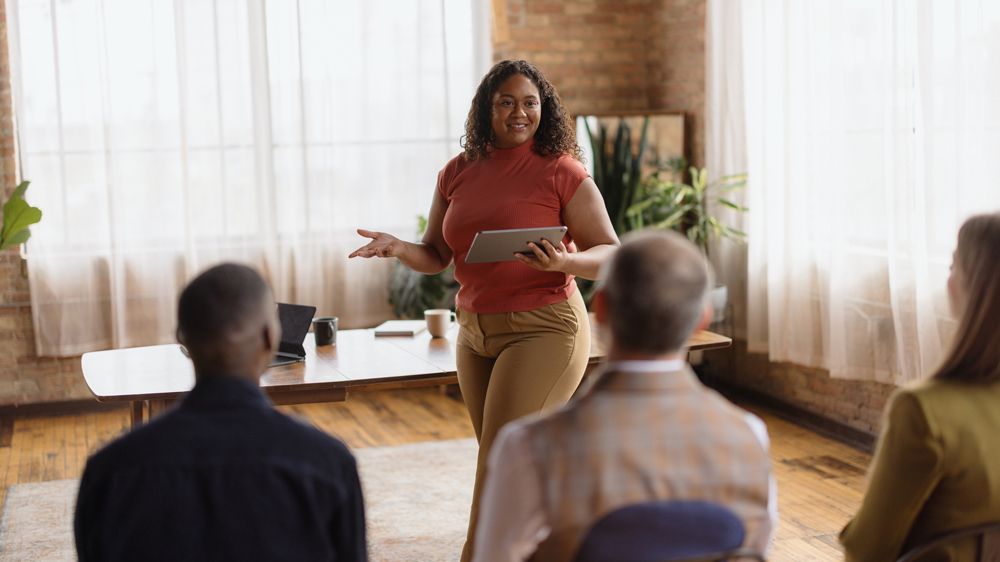 Confident young woman leads a business meeting