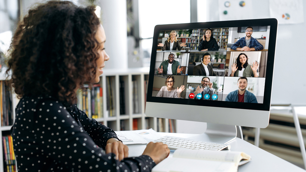 woman leading a zoom meeting online in modern office