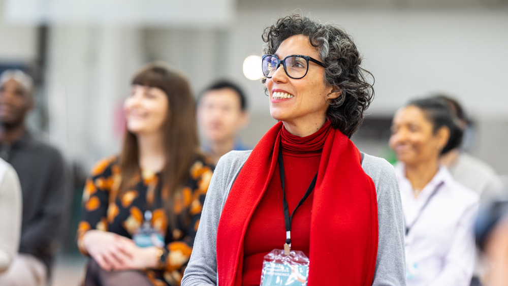 mature woman learning in business conference or training