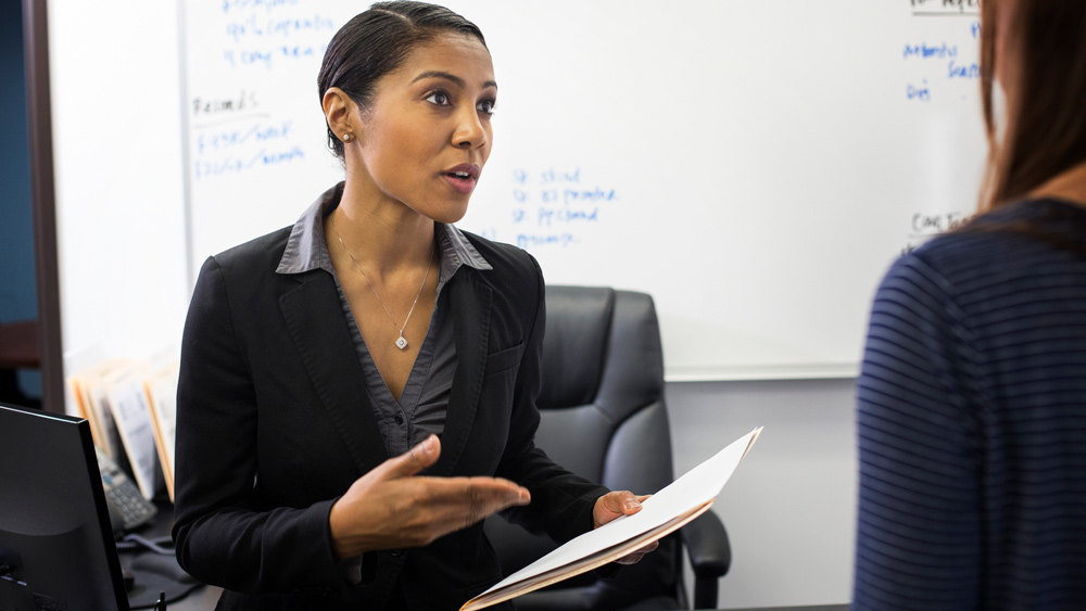 businesswomen talking in office