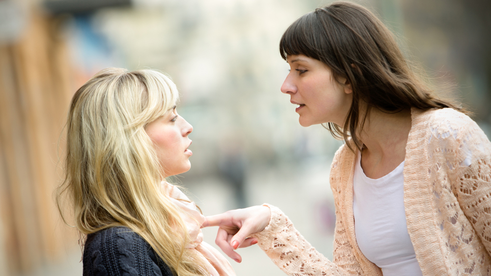 Two women arguing on the street